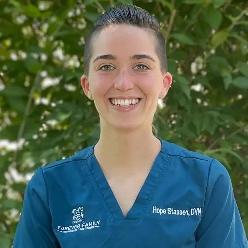 Doctor Hope Stassen wearing blue scrubs and smiling